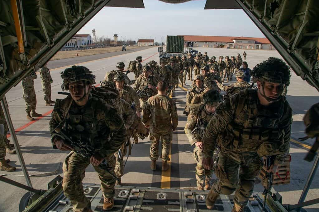 Soldiers and Airmen conduct deployment activities at Aviano Air Base, Italy, Feb. 24, 2022. Soldiers of 2nd Battalion, 503rd Infantry Regiment, 173rd Airborne Brigade, departed Caserma Ederle, Vicenza, Italy, for Latvia to assure our Allies and partners and deter aggression. (U.S. Army photo by Sgt. Meleesa Gutierrez)